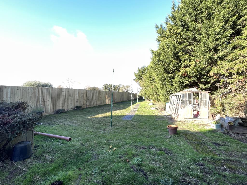 Lot: 121 - SEMI-DETACHED HOUSE FOR MODERNISATION WITH POTENTIAL FOR EXTENSION ON LARGE PLOT - Rear garden of of cottage for refurbishment
